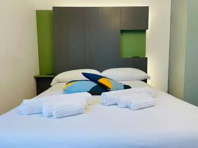 Letto o letti in una camera di Dimora del Mercante