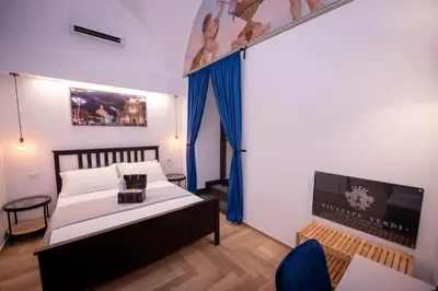 Letto o letti in una camera di Giuseppe Verdi Luxury Apartments Catania Centro