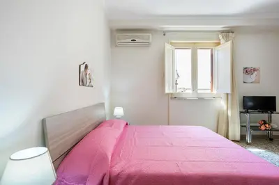 Letto o letti in una camera di GuestHost - Tra il Centro e il Mare Apartment con terrazzo