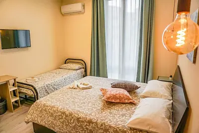 Letto o letti in una camera di B&B IL BASTIONE