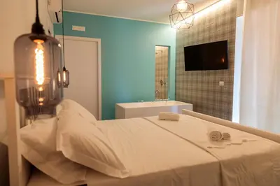 Letto o letti in una camera di B&B LA CUPOLA