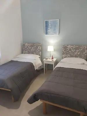 Letto o letti in una camera di B&B Carpe Diem