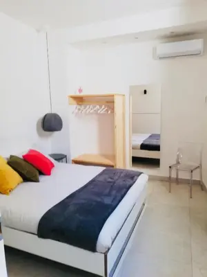 Letto o letti in una camera di Casa ABBATUZZU