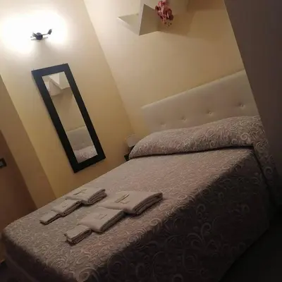 Letto o letti in una camera di Oasi del Borgo