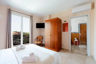 Letto o letti in una camera di B&B Ruota di Carretto