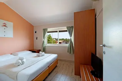 Letto o letti in una camera di B&B Ruota di Carretto