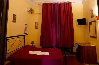 Letto o letti in una camera di Hotel Etnea