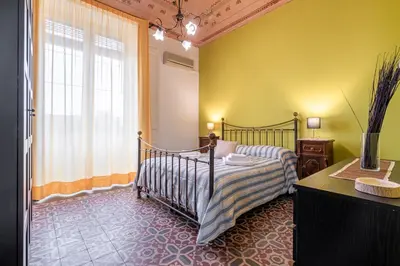Letto o letti in una camera di Fermata Jonia