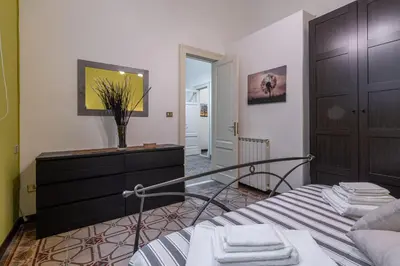 Letto o letti in una camera di Fermata Jonia