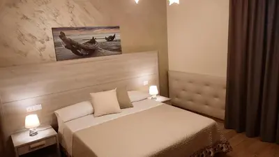 Letto o letti in una camera di Oasi Perla Del Mare Rooms
