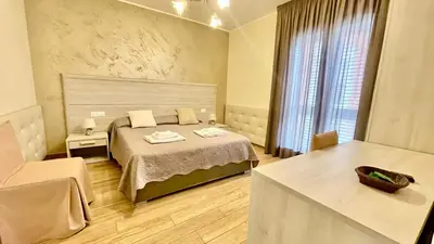 Letto o letti in una camera di Oasi Perla Del Mare Rooms