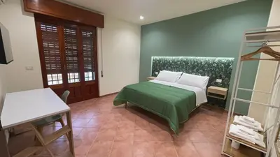 Letto o letti in una camera di Oasi Perla Del Mare Rooms