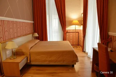 Letto o letti in una camera di Catania Centro Rooms