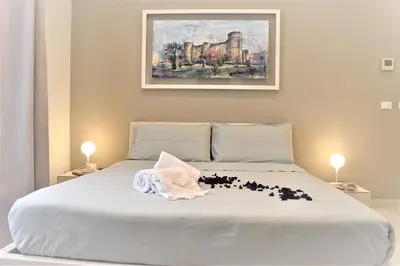 Letto o letti in una camera di CATANIA LIVING ROOMS