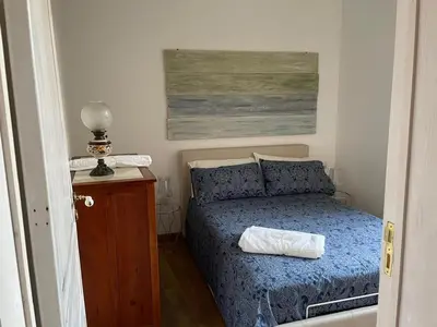 Letto o letti in una camera di donna serena Aci Castello