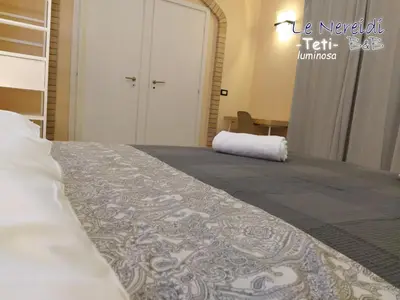 Letto o letti in una camera di Le Nereidi b&b Acireale Centro