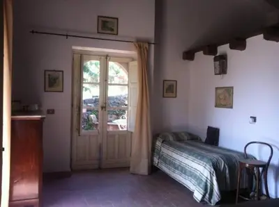 Letto o letti in una camera di La Rocca della Rosa