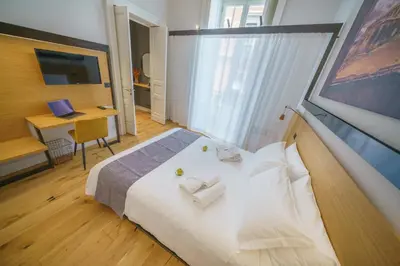 Letto o letti in una camera di Cafuné Rooms