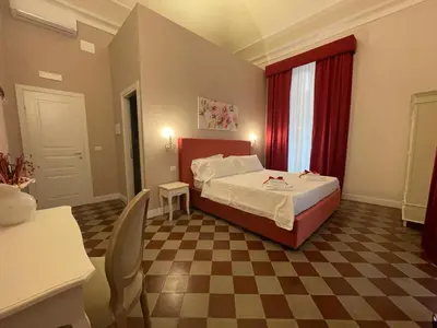 Letto o letti in una camera di B&B Romeo Luxury Rooms