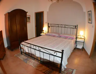 Letto o letti in una camera di Casa Romeo