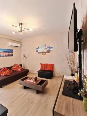 TV o dispositivi per l'intrattenimento presso EtnaCiTy Guest House Apartment