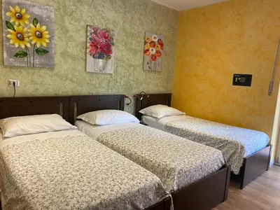 Letto o letti in una camera di B&B CATANIA CENTRO - Charme & More