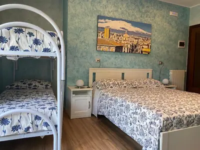 Letto o letti in una camera di B&B CATANIA CENTRO - Charme & More