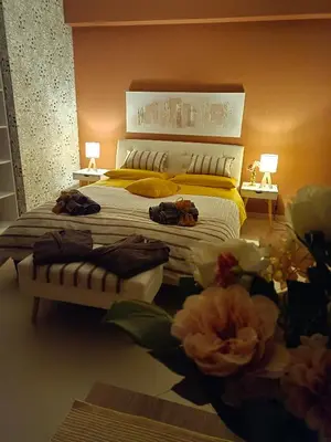 Letto o letti in una camera di Villa Sant'Andrea