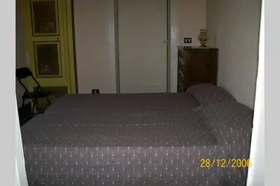 Letto o letti in una camera di CASA DELLE PALME GIARRE SICILIA A 3 KM DAL MARE