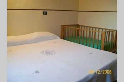 Letto o letti in una camera di CASA DELLE PALME GIARRE SICILIA A 3 KM DAL MARE