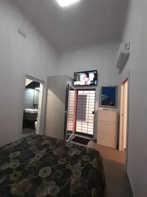 Letto o letti in una camera di Caronda House