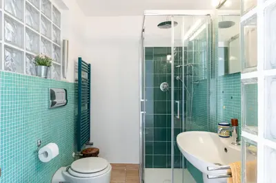 Bagno di GuestHost - Via Etnea Cozy Apartment with Balcony