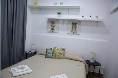 Letto o letti in una camera di Borgo San Giovanni Rooms Catania