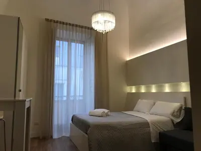 Letto o letti in una camera di Motta Palace Apartments & Rooms