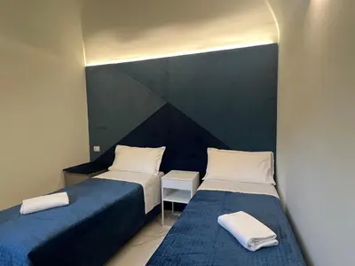 Letto o letti in una camera di Motta Palace Apartments & Rooms