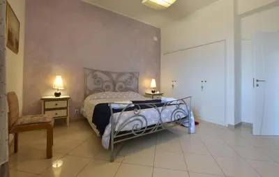 Letto o letti in una camera di Villa Chrilu'