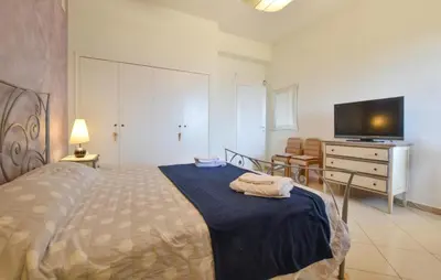 Letto o letti in una camera di Villa Chrilu'
