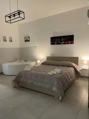 Letto o letti in una camera di Rosa Dei Venti Apartment