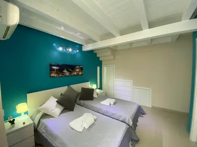 Letto o letti in una camera di Bnb Archimede