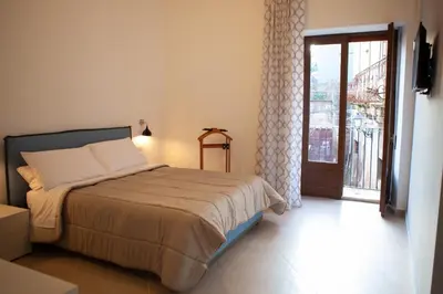 Letto o letti in una camera di CasaPaola b&b Rooms