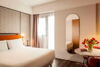 Letto o letti in una camera di NH Catania Centro
