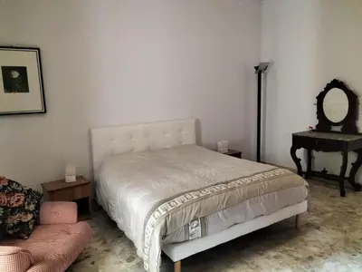 Letto o letti in una camera di Casa del Grillo in centro e nei pressi del mare