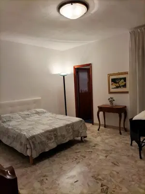 Letto o letti in una camera di Casa del Grillo in centro e nei pressi del mare