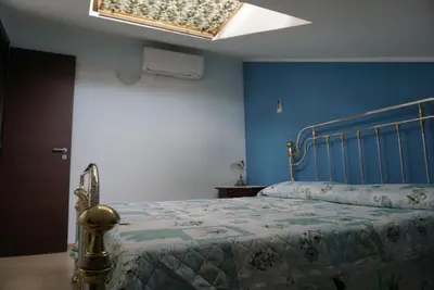 Letto o letti in una camera di Villetta Artale Marina