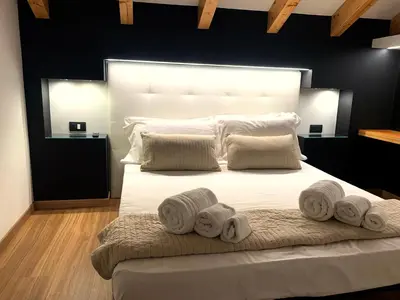 Letto o letti in una camera di Ottomood House Catania