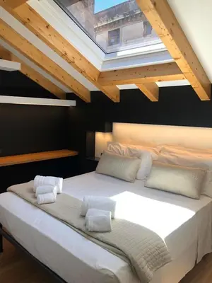 Letto o letti in una camera di Ottomood House Catania