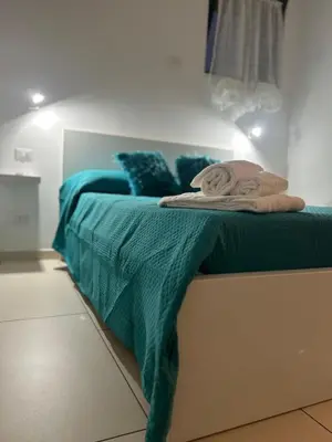 Letto o letti in una camera di J&S Sicily Apartments