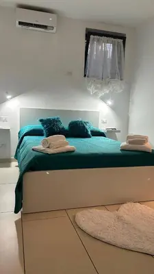 Letto o letti in una camera di J&S Sicily Apartments