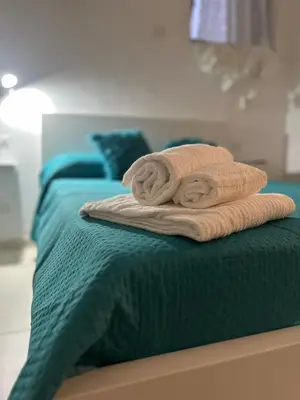 Letto o letti in una camera di J&S Sicily Apartments