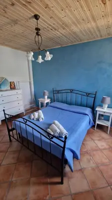 Letto o letti in una camera di Casa della Zagara
